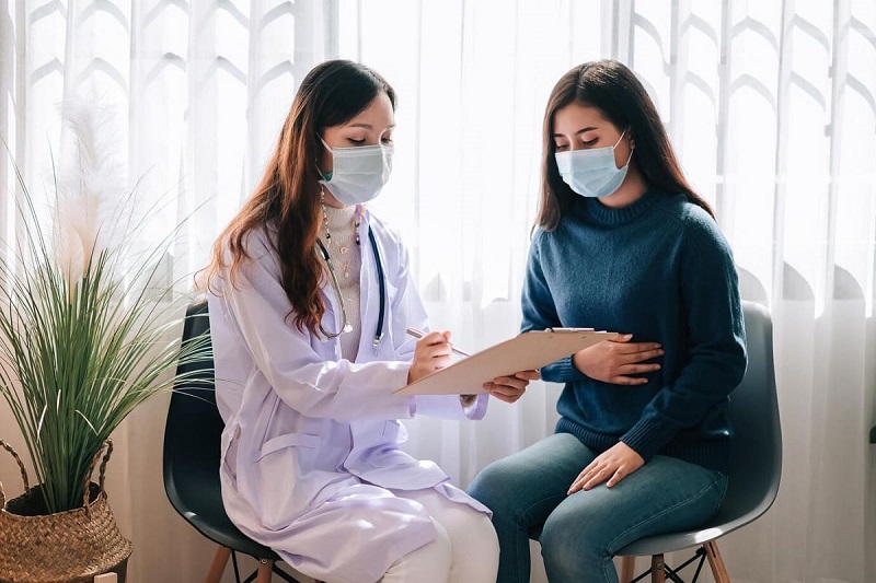 doctor visit young adult woman